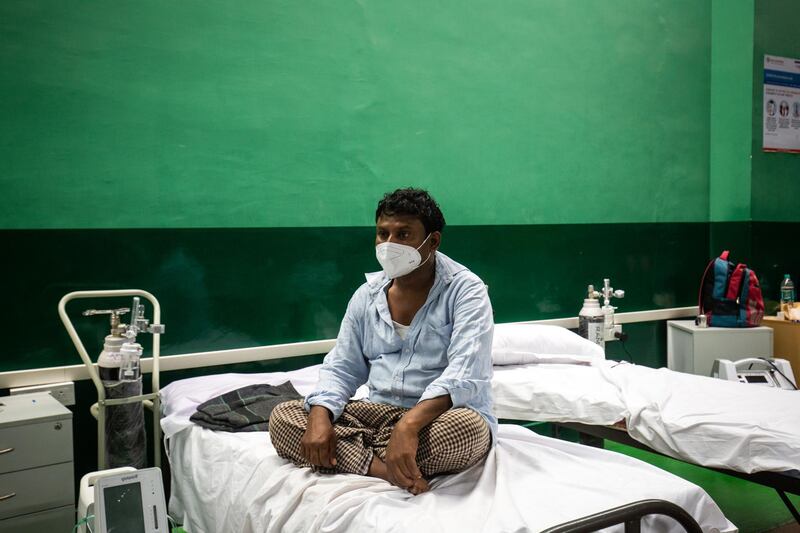 BENGALURU, INDIA - MAY 06: Patients who have contracted Covid-19 rest inside the ICU ward of a hospital treating Covid-19 patients on May 06, 2021 in Bengaluru, India. India recorded more than 360,000 coronavirus cases in a day for the 12th day in a row on Monday as the total number of those infected according to Health Ministry data neared 20 million. The real figure could be up to ten times higher, many health experts say, due to a lack of widespread testing or reporting, and only patients who succumbed in hospitals being counted. A new wave of the pandemic has totally overwhelmed the country's healthcare services and has caused crematoriums to operate day and night as the number of victims continues to spiral out of control. (Photo by Abhishek Chinnappa/Getty Images)