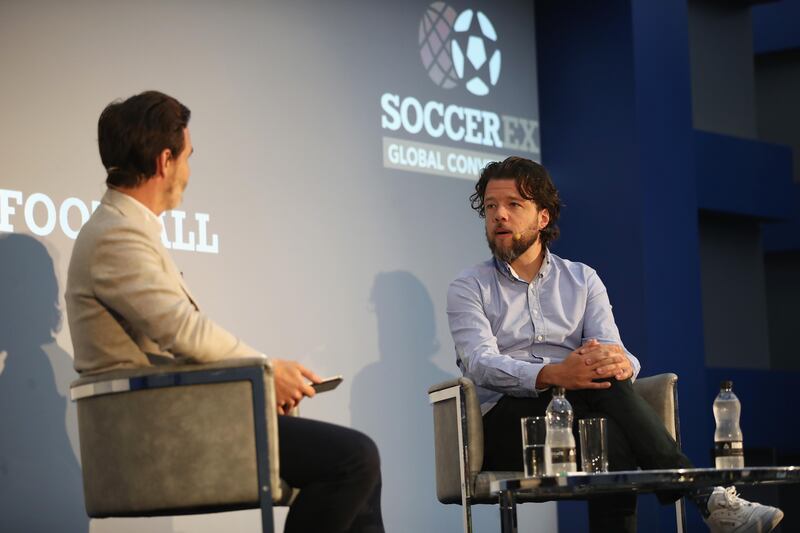 MANCHESTER, ENGLAND - SEPTEMBER 04:  Jerry Newman (R), Facebook Sport Partnership Lead, EMEA talks during day 1 of the Soccerex Global Convention at Manchester Central Convention Complex on September 4, 2017 in Manchester, England.  (Photo by Lynne Cameron/Getty Images for Soccerex)