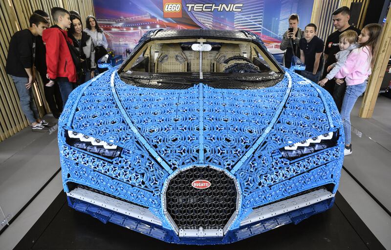 A driveable, full-size Bugatti Chiron car made from Lego Technic blocks at an exhibition in Moscow's Gorky Park.  The model, which is built using more than a million pieces and weighs 1,500 kilograms, has a top speed of 20kph. Lego specialists spent 13.438 hours engineering and assembling the model without using a single drop of glue. AFP