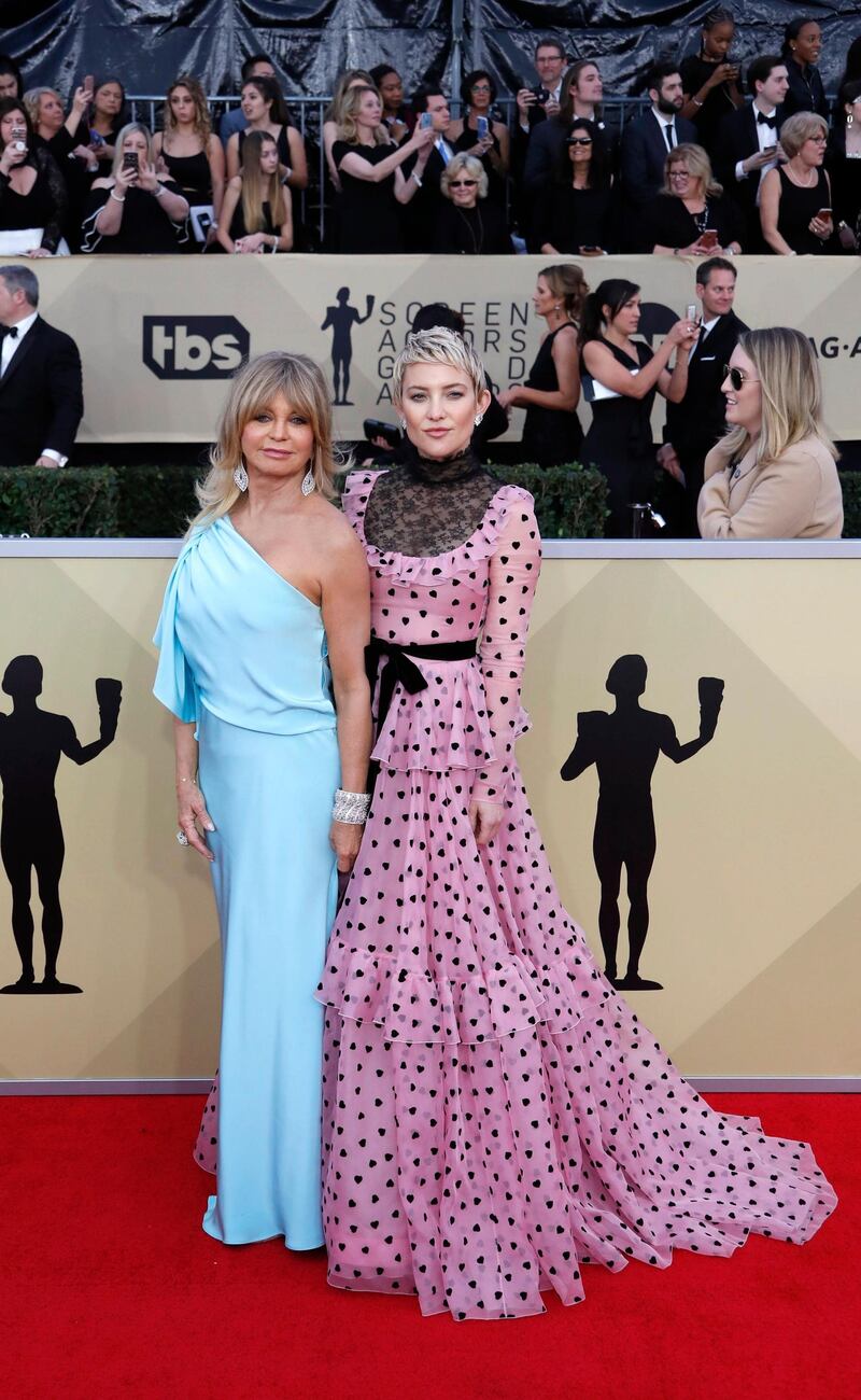 Mother-and-daughter duo Goldie Hawn and Kate Hudson wore Kate Spade and Valentino respectively. We love the hearts on Hudson's pink Valentino. Mike Nelson / EPA