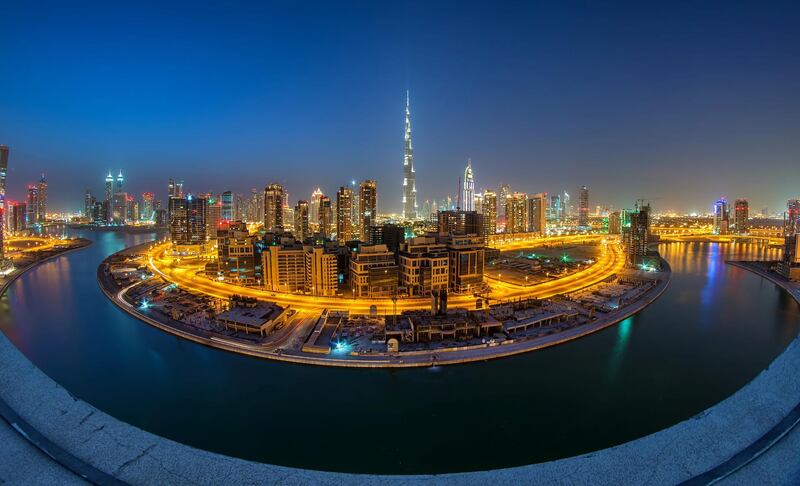 Aerial view of Business Bay Dubai at night.