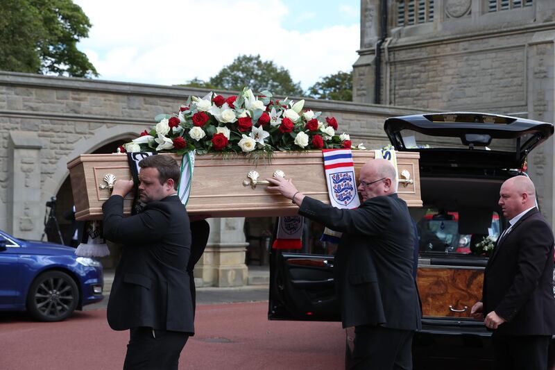 The coffin of British football legend Jack Charlton is carried into the West Road Crematorium. AFP