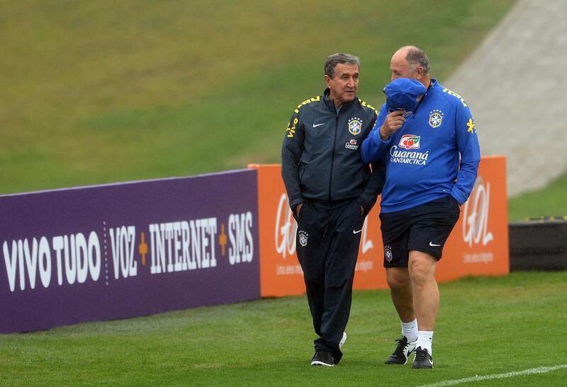 Brazil manager Luiz Felipe Scolari, right, talks to technical coordinator Carlos Alberto Parreira during a training session for the Brazil national squad on Wednesday. Vanderlei Almeida / AFP / May 28, 2014