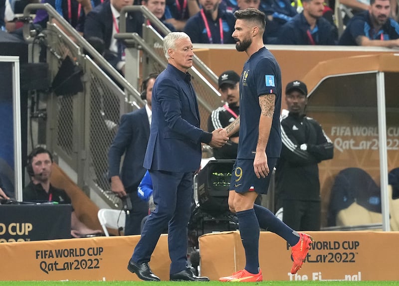 France's Olivier Giroud shakes hands with manager Didier Deschamps after being substituted in the first half. PA