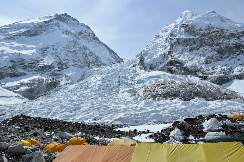 Tents of mountaineers are pictured at the Everest base camp in the Mount Everest region of Solukhumbu district on May 3, 2021. (Photo by Prakash MATHEMA / AFP)