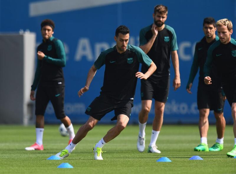 Sergio Busquetstakes part in a drill. David Ramos / Getty Images