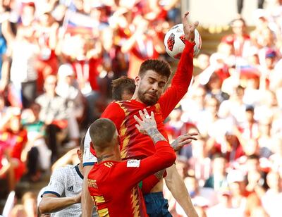 Soccer Football - World Cup - Round of 16 - Spain vs Russia - Luzhniki Stadium, Moscow, Russia - July 1, 2018  Spain's Gerard Pique handles the ball and concedes a penalty                REUTERS/Kai Pfaffenbach