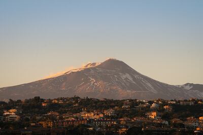 Catania sits at the foot of the volcano Mount Etna. Photo: Samir Kharrat