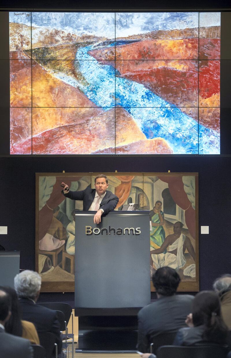 Image ��Licensed to i-Images Picture Agency. 24/10/2018. London, United Kingdom. 

Auctioneer Ralph Taylor (pictured) of Bonham's Auctioneers on New Bond Street, London, UK, sells works of art from the Abraaj collection, which include Manjit Bawa's oil on Canvas 'Untitled'  and Rashid Rana's 'Red Carpet'.



Picture by Ben Stevens / i-Images
