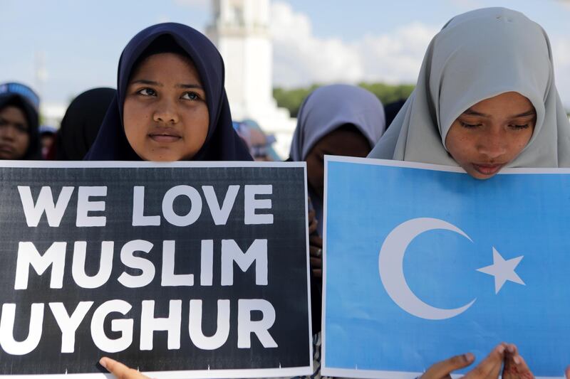 Acehnese take part in a protest rally in support of Muslims in China, in Banda Aceh, Indonesia. EPA