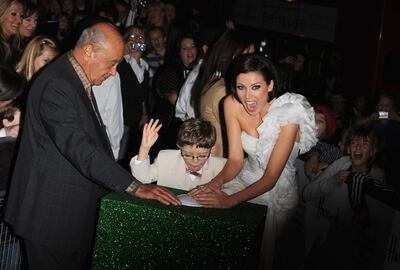Al Fayed and pop star Dannii Minogue switch on the Harrods Christmas lights in 2009. Getty Images