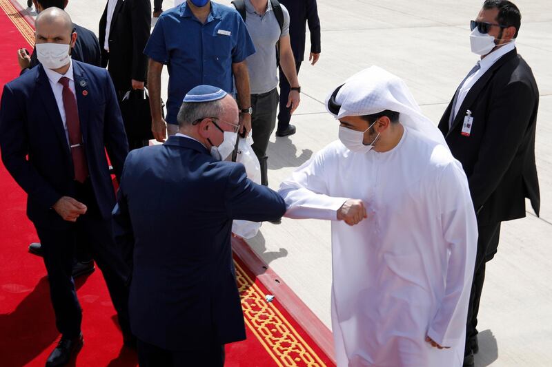 Israeli National Security Adviser Meir Ben-Shabbat greets an Emirati official as he makes his way to board the plane to leave Abu Dhabi.  EPA