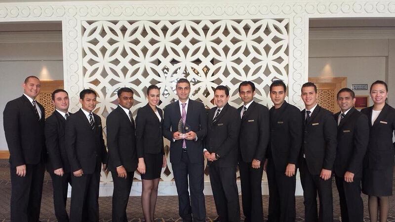 Lakshan Rodrigo, second from the right, with former colleagues at the Grant Hyatt hotel in Dubai