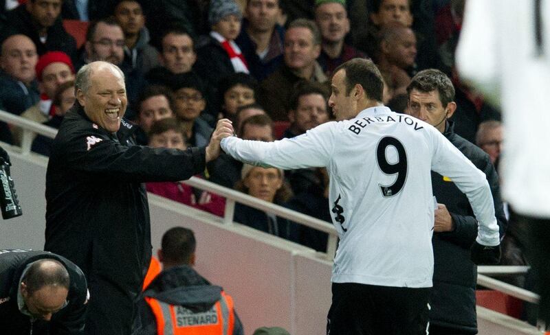 Fulham's Dimitar Berbatov, right, celebrates with manager Martin Jol after scoring from the penalty spot against Arsenal during their English Premier League soccer match at the Emirates stadium, London, Saturday, Nov. 10 , 2012. (AP Photo/Tom Hevezi) *** Local Caption ***  Britain Soccer Premier League.JPEG-065f4.jpg