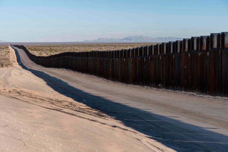(FILES) In this file photo taken on December 23, 2018 This photo shows the border fence near New Mexico's Highway 9, near Santa Teresa. Sixteen US states sued President Donald Trump's administration on February 18, 2019 over his decision to declare a national emergency to fund a wall on the southern border with Mexico, saying the move violated the constitution. The lawsuit, filed in a federal court in California, said the president's order was contrary to the Presentment Clause that outlines legislative procedures and the Appropriations Clause, which defines Congress as the final arbiter of public funds. / AFP / Paul Ratje
