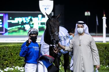 DUBAI, UNITED ARAB EMIRATES. 25 FEBRUARY 2021. Jockey Lanfranco Dettori with Saeed bin Suroor celebrate their win of the Nad Al Sheba Trophy race, 2810M Turf, at Meydan Racecourse. Photo: Reem Mohammed / The National Reporter: Amith Passala Section: SP