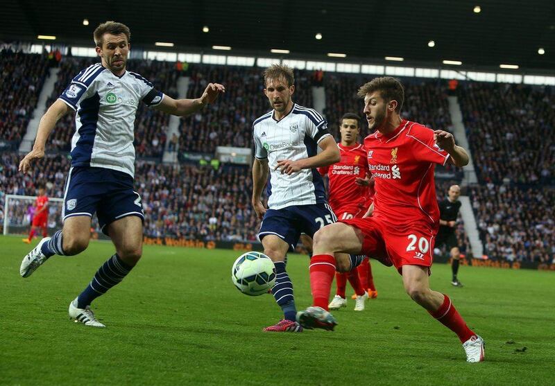 Liverpool's Adam Lallana dribbles against West Bromwich Albion on Saturday in the Premier League. Geoff Caddick / AFP / April 25, 2015  