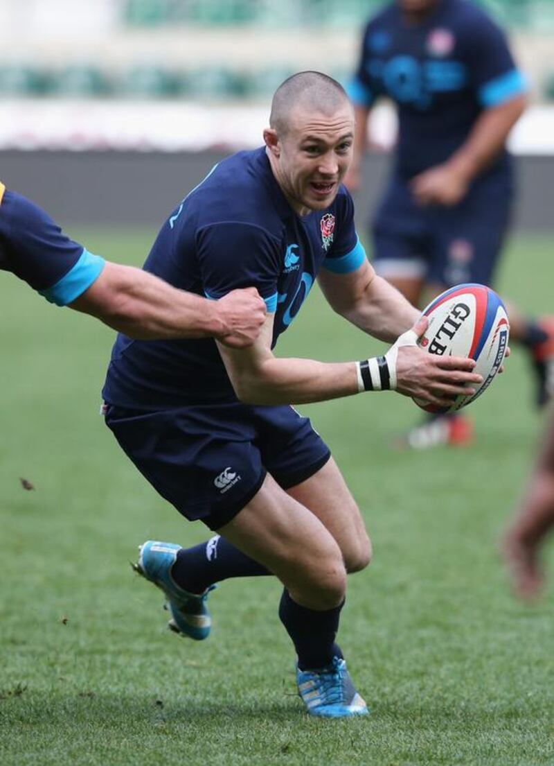 Mike Brown runs with the ball during an England training session at Twickenham Stadium on March 5, 2014. David Rogers / Getty Images