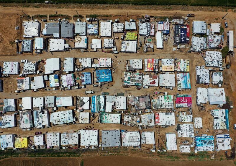 An aerial view shows an informal Syrian refugee camp, in the Bekaa valley town of Saadnayel, east Lebanon. Lebanon. AP