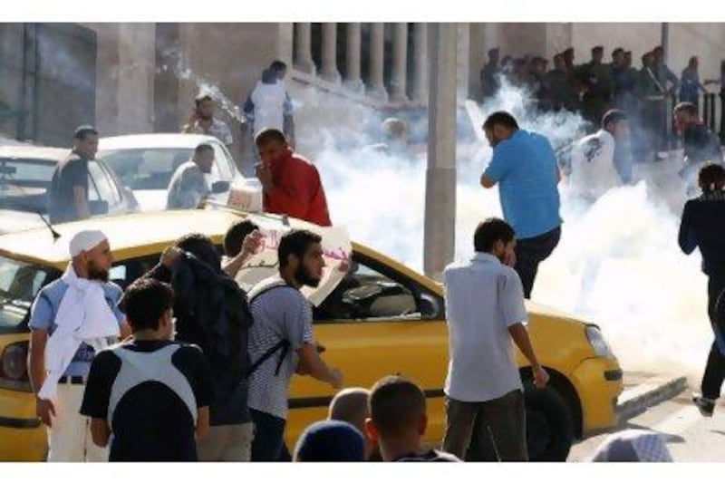 Tunisian police fire tear gas to break up a protest on Friday by Islamists who oppose the screening of the film Persepolis.