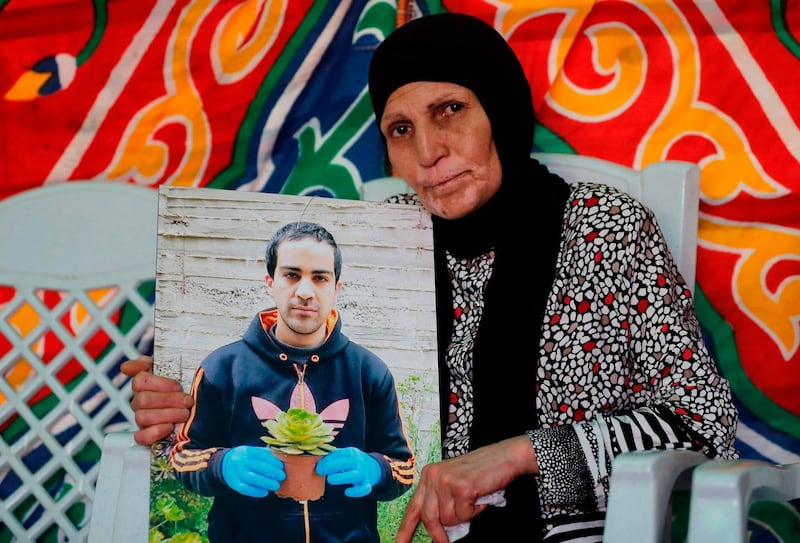 The mother of Iyad Hallak, a 32-year-old Palestinian man with autism who was shot dead by Israeli police when they mistakenly thought he was armed with a pistol, mourns her son at their home in annexed east Jerusalem on June 1, 2020 Last week a police officer who believed he was armed shot him dead, leaving his family searching for answers and igniting widespread grief and anger. Thousands of mourners massed for his funeral while the social media hashtag #PalestinianLivesMatter echoed fury over police violence and racism in the United States. Hallak, brown-haired, well-built and with broad shoulders, cut an imposing figure but had the mental age of an eight-year-old, according to his bereaved family.
 / AFP / AHMAD GHARABLI
