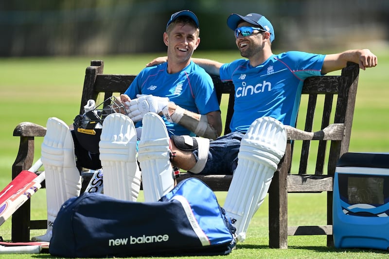 England's Olly Stone, left, and Mark Wood take a break at training. Getty