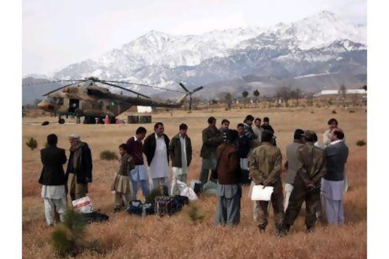 Pakistani tribesmen wait to board an army helicopter this week in Parachinar in Kurram agency, Pakistan's tribal region. A major road in the area was blocked in 2007 as part of tribal and sectarian violence that has killed more than 3,000 people.