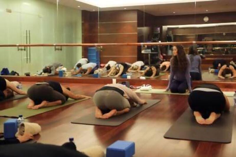 The instructor Jennifer Stewart holds a class at the St Regis Hotel on Saadiyat Island. Ravindranath K / The National