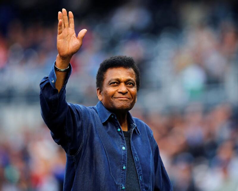 FILE PHOTO: Country singer Charley Pride waves to baseball fans during a pre-game ceremony honoring former Negro Leagues baseball players in San Diego, California May 31, 2013.   REUTERS/Mike Blake/File Photo