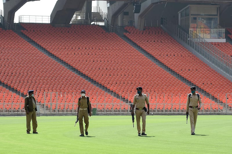 Police personnel inspect the Narendra Modi Stadium. AFP