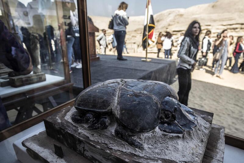 The statue of a scarab is displayed after the announcement of a new discovery carried out by an Egyptian archaeological team in Giza's Saqqara necropolis, south of the capital Cairo. AFP