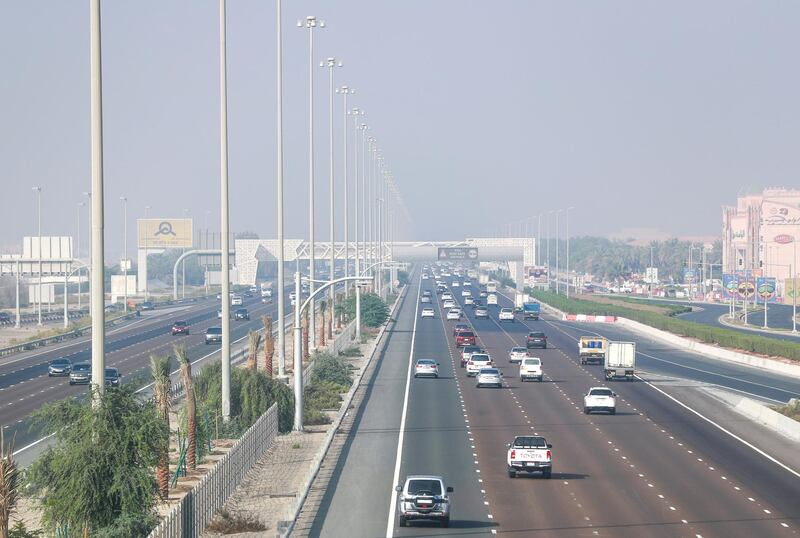 Abu Dhabi, United Arab Emirates, October 5, 2020.  Hazy and foggy weather at the E 10 flyover at Khalifa City, Abu Dhabi.
Victor Besa/The National
Section:  NA
For:  weather/standalone