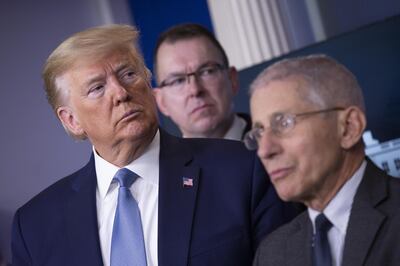U.S. President Donald Trump, left, listens during a Coronavirus Task Force news conference in the briefing room of the White House in Washington, D.C., U.S., on Saturday, March 21, 2020. Trump said negotiators in Congress and his administration are "very close" to agreement on a coronavirus economic-relief plan that his economic adviser said will aim to boost the U.S. economy by about $2 trillion. Photographer: Stefani Reynolds/CNP/Bloomberg