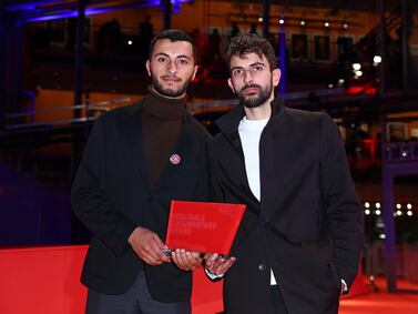 Basel Adra, left, and Yuval Abraham with the Berlinale documentary award for the movie No Other Land. Getty Images