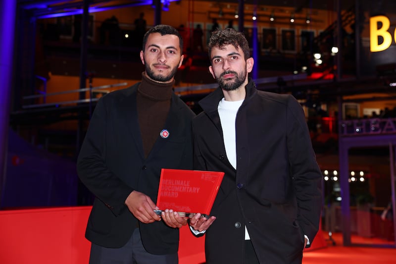 Basel Adra, left, and Yuval Abraham with the Berlinale documentary award for the movie No Other Land. Getty Images