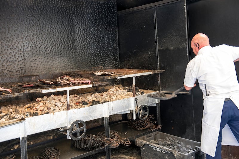 A grill master at work at a seafood restaurant in Getaria, the seaside village known for its excellent turbot, fresh fish and shellfish.