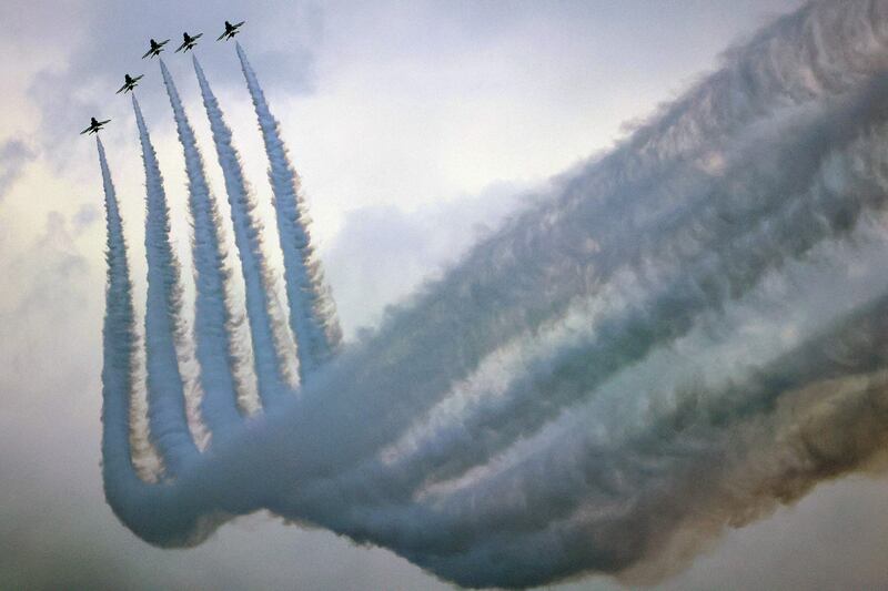 Pilots of the Royal Saudi Air Force Hawks aerobatic team perform during a show in Kuwait City on February 26, 2023 as the Gulf state marks its 62nd Independence Day and 32nd anniversary of the end of the Gulf war with the liberation of Kuwait from Iraqi occupation.  (Photo by YASSER AL-ZAYYAT  /  AFP)