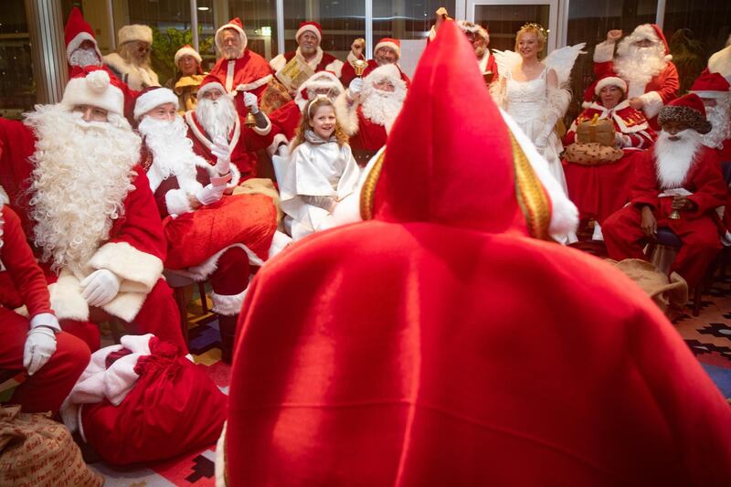 Members of the Berlin Santa Claus Headquarters attend a Santa Claus assembly at the Friedrichsfelde Palace in Berlin, Germany.  EPA