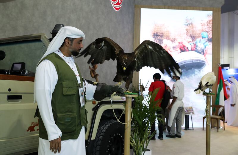 Staff from Al Ain Zoo showing some birds and reptiles at the Abu Dhabi stand.
