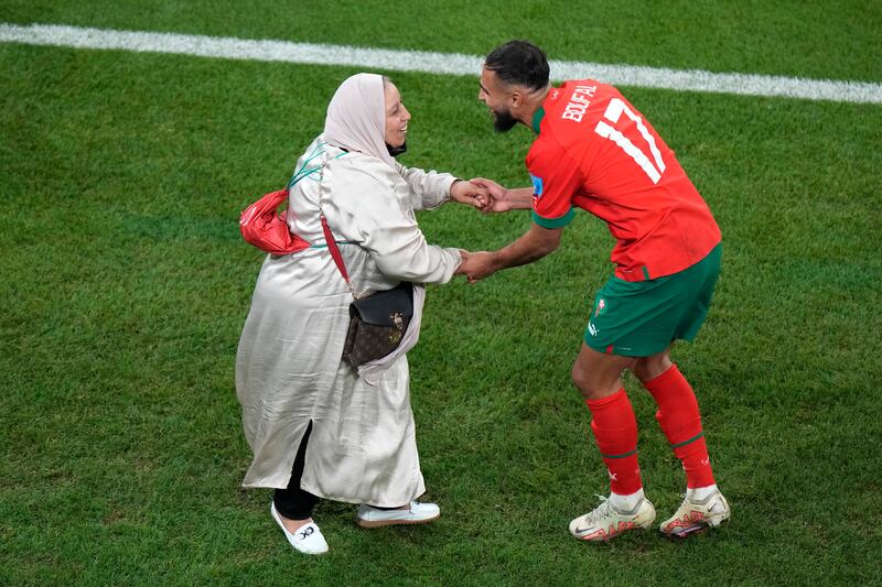 Morocco's Sofiane Boufal, right, celebrates with his mother after his team's win in the World Cup quarter-final against Portugal. AP