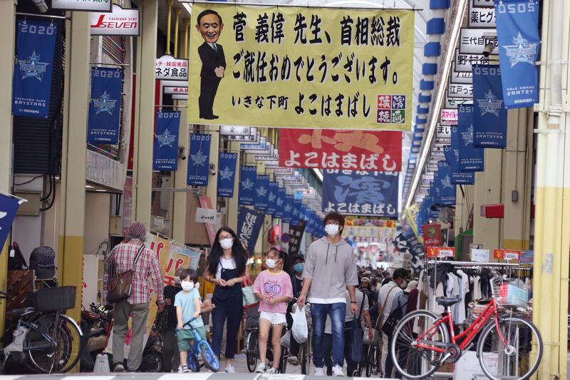 People walk at a shopping mall in Yokohama near Tokyo. AP Photo