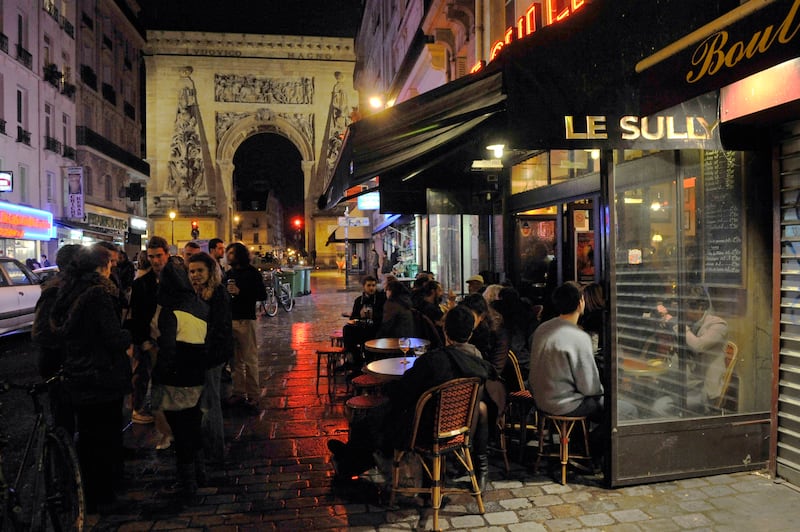 Teeming crowds pack out the street’s restaurants, cafes and food stores. AFP