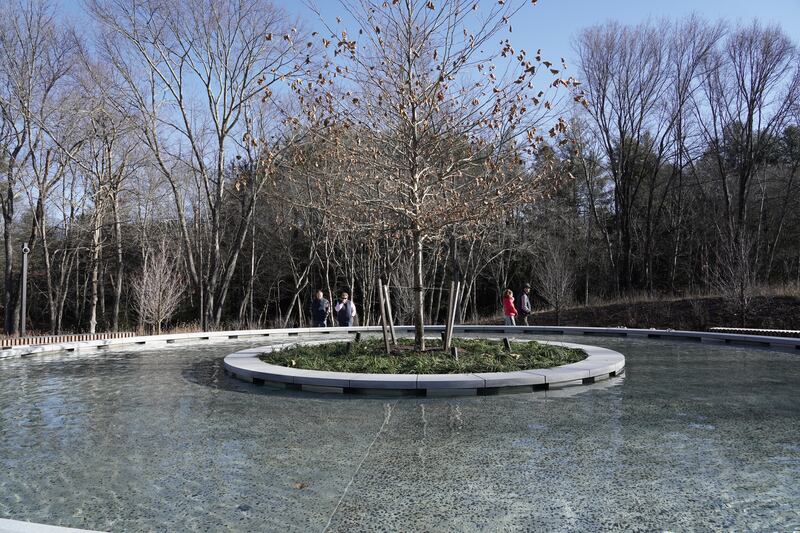 A young sycamore tree in the water feature's central planter symbolises the young age of the victims. Most were between six and seven years old. The National
