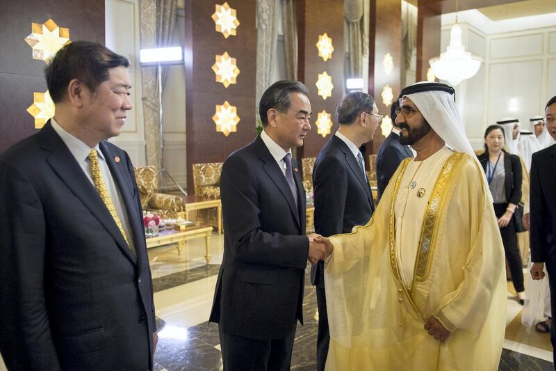 ABU DHABI, UNITED ARAB EMIRATES - July 19, 2018: HH Sheikh Mohamed bin Rashid Al Maktoum, Vice-President, Prime Minister of the UAE, Ruler of Dubai and Minister of Defence (R) greets HE Wang Yi, Minister of Foreign Affairs of China (2nd L), during a reception held for HE Xi Jinping, President of China (not shown), at the Presidential Airport.

( Saif Al Muhairi / Government of Dubai Media Office )
---