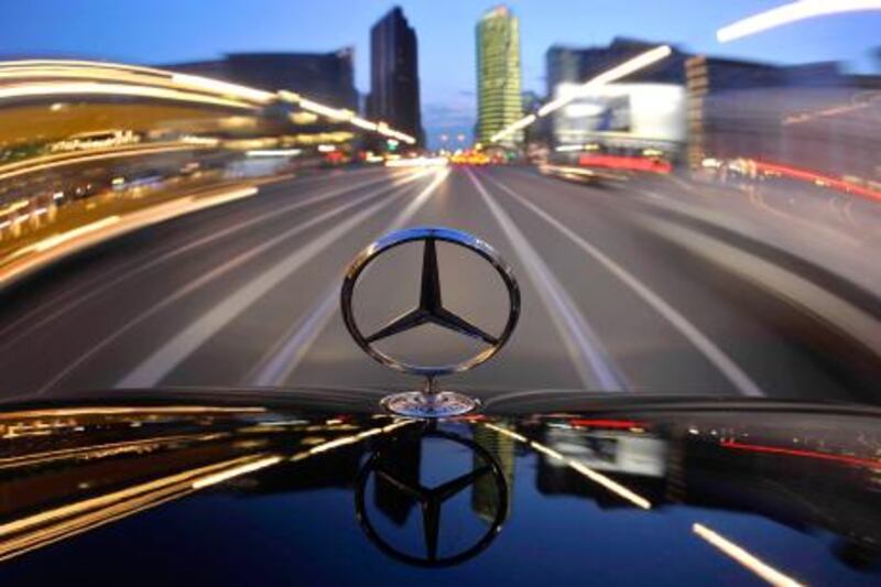 FILE - In this April 7 2009 file picture the star emblem on the hood of a  Mercedes-Benz car produced by Daimler is seen near Potsdam Square, Potsdamer Platz, in Berlin. German auto and truck maker Daimler AG said Wednesday, July 29, 2009 it lost euro 1.06 billion (US$ 1.51 billion) in the second quarter as sinking sales from the recession and charges related to its stake in Chrysler weighed on the bottom line. But the result was better than analyst predictions and company shares rose. (AP Photo/Gero Breloer, file) *** Local Caption ***  FRA141_Germany_Earns_Daimler.jpg