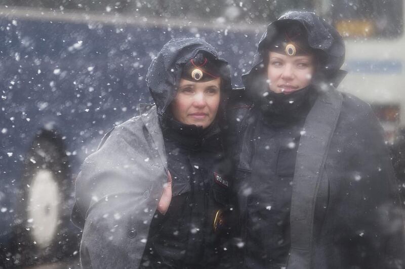 Russian police women stand guard under heavy snow fall after a rehearsal for the Victory Day military parade, slated for May 9 at at the Square to celebrate 69 years of victory in WWII, in Moscow, Russia. Pavel Golovkin / AP