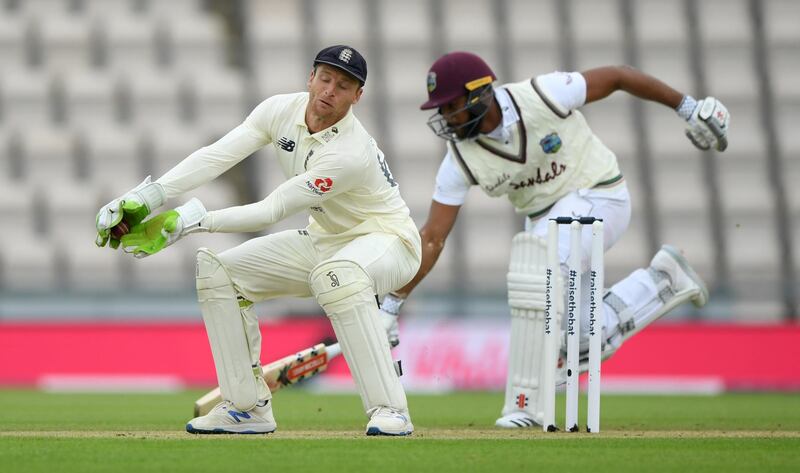 England wicketkeeper Jos Buttler takes the ball as Kraigg Brathwaite of the West Indies makes his ground. Getty