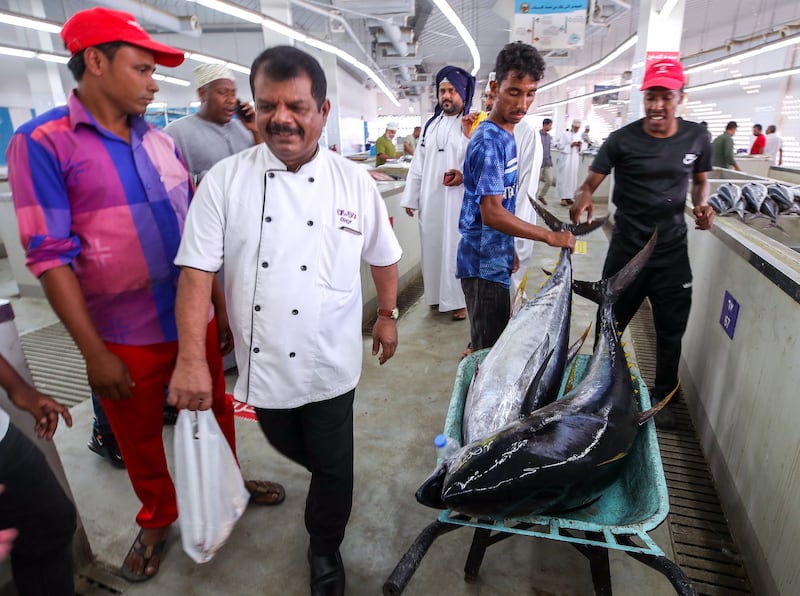 The fish market stretches along the Mutrah waterfront in Muscat. Omani fishermen arrive early to unload, prepare and then sell their day’s catch. 