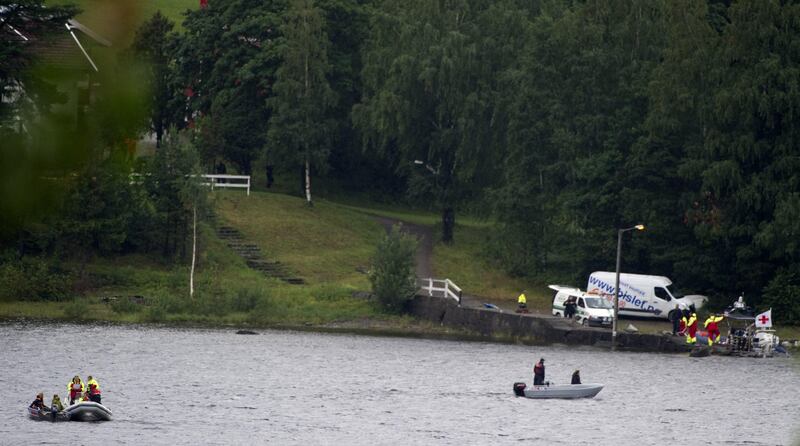 Police and emergency services search the waters for more victims some around Utoeya island , some 40 km south west of Oslo, on July 23 , 2011.  At least 91 people were killed in Friday's attacks in Norway, a bombing in central Oslo and a series of shootings on an island just outside the capital, and the figure could rise, a senior police officer said. Police had also found explosives on the island of Utoeya, where a gunman opened fire on young people at a summer camp organised by the ruling Labour Party, Sveinung Sponheim, acting commissioner for Oslo police, told reporters. AFP PHOTO / ODD ANDERSEN
 *** Local Caption ***  476061-01-08.jpg