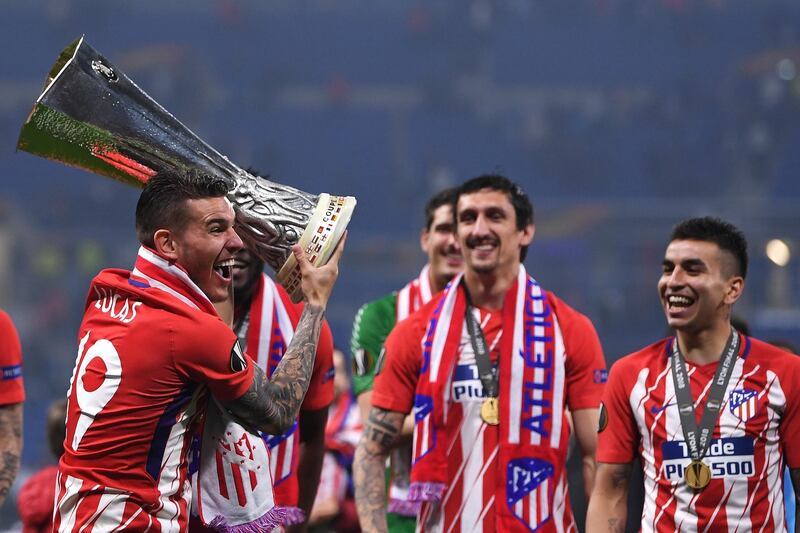 Lucas Hernandez of Atletico Madrid celebrates with the trophy following the UEFA Europa League Final between Olympique de Marseille and Club Atletico de Madrid at Stade de Lyon in Lyon, France, on May 16, 2018. Laurence Griffiths / Getty Images